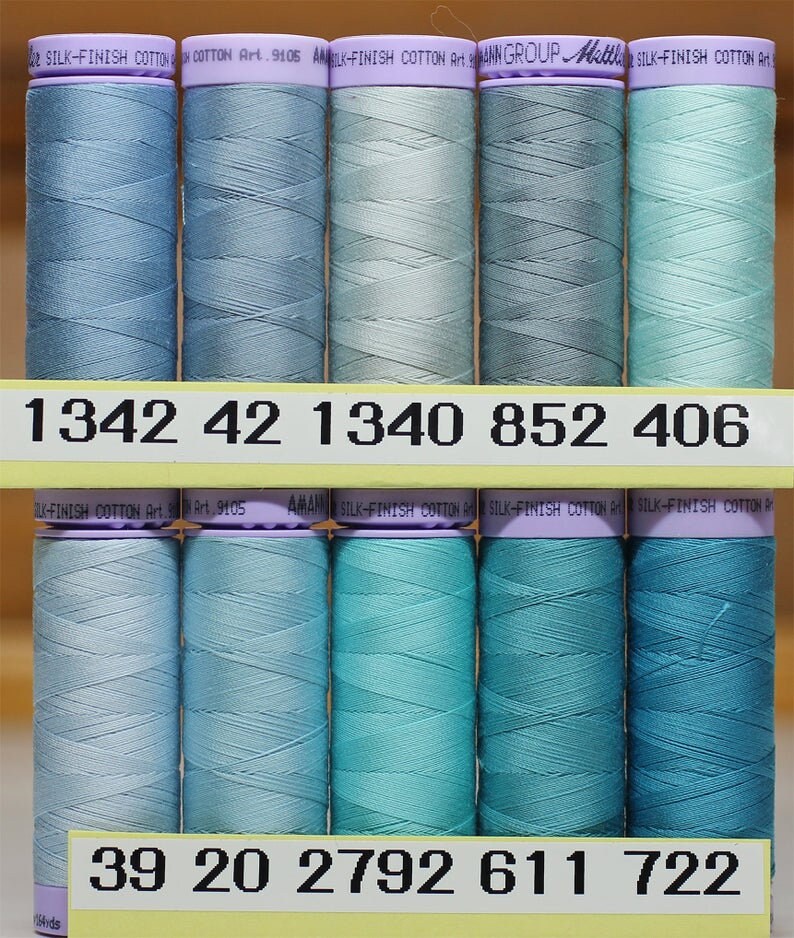 Mettler cotton thread.  Fifty weight solids, silk-finished thread, 16…