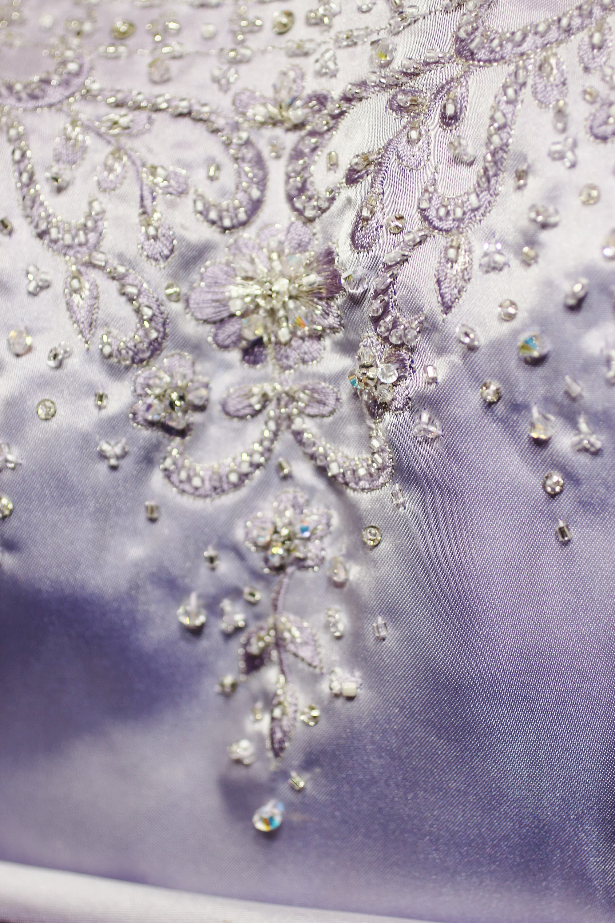 Wedding gown new. Alfred Angelo, light lilac, satin, Wedding gown, with Swarovski crystals, overall beads and cathedral train, size 10- 12.