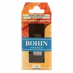 May include: A pack of 12 Bohin Demi-Longues Betweens needles for patchwork and quilting. The needles are packaged in a clear plastic case with a brown label that says "Bohin France".