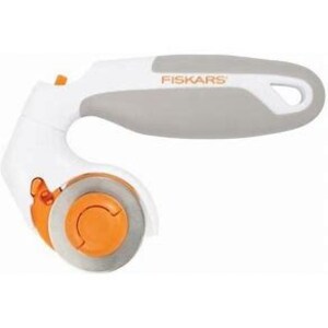May include: White and orange rotary cutter with a gray handle. The cutter has a safety lock and a blade guard. The handle has the word "Fiskars" printed on it.