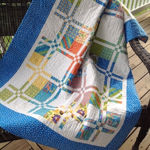 Blue, Yellow, Green, and Orange Connecting Squares Baby quilt