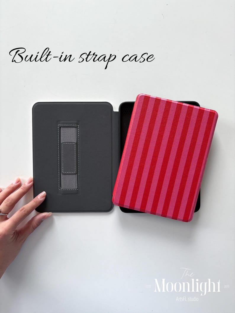 May include: A grey tablet case with a built-in strap, open to show a tablet with a red and pink striped cover. The text "Built-in strap case" is above the case. The Moonlight ArtsFL studio logo is in the bottom right corner.