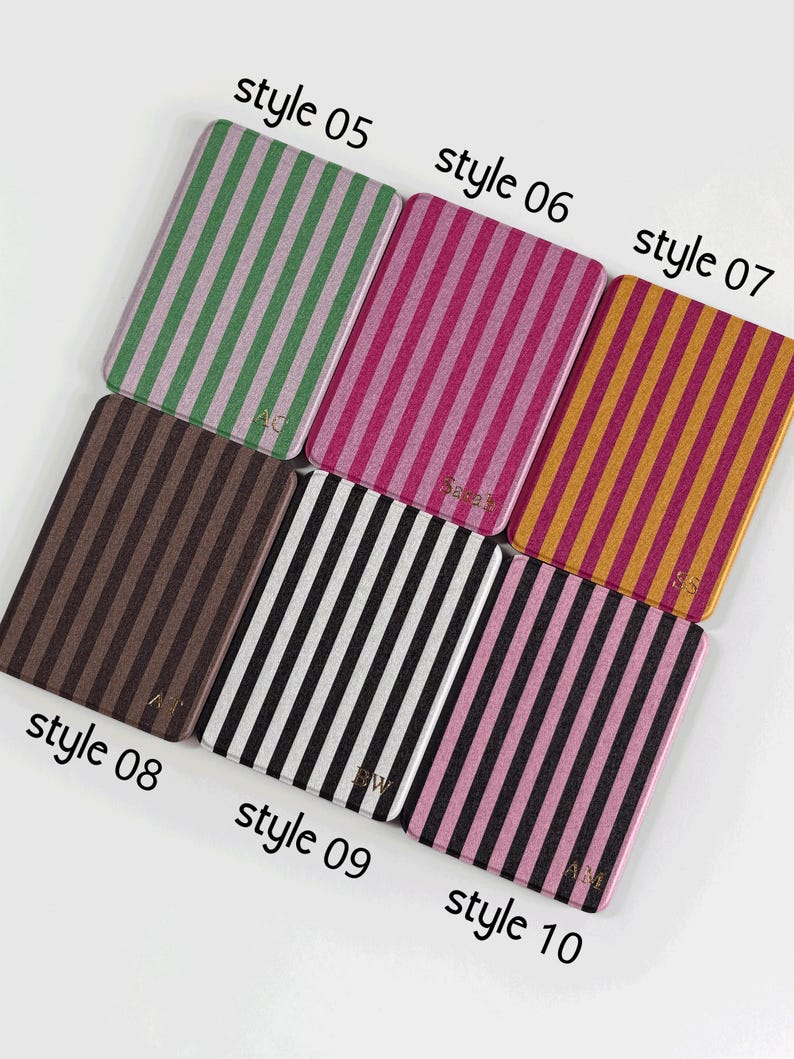 May include: A selection of rectangular cases featuring vertical stripes in diverse colour schemes. Styles include green and pink, pink and red, gold and orange, brown, black and white, and pink and black. Each case is labelled with "style" and a number.