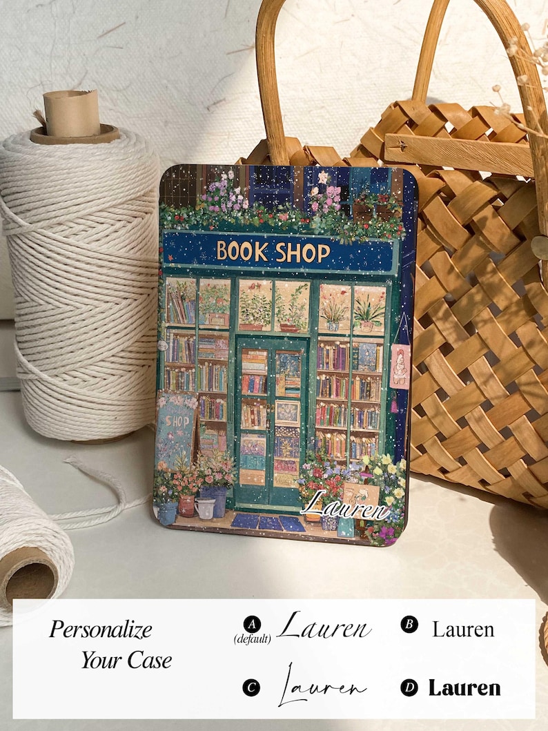 May include: A personalized phone case with a whimsical illustration of a book shop with a snowy backdrop. The text "BOOK SHOP" is above the shop, and the name "Lauren" is written below the shop.