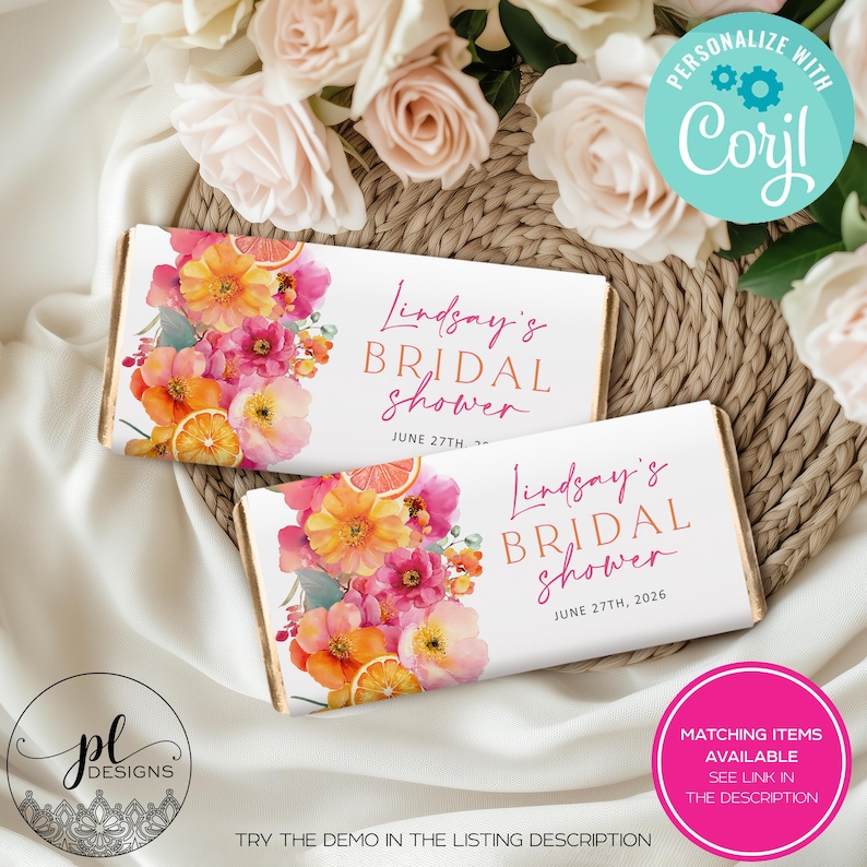 May include: Two white candy bar wrappers with floral designs and the text "Lindsay's Bridal Shower" in pink. The wrappers feature watercolor flowers in shades of pink, orange, and yellow, with orange slices. The date June 27th, 2026 is also printed.