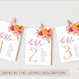 May include: Three white table number cards, 1, 2, and 3, are displayed. Each card features a floral design with pink and orange flowers and a slice of orange. The word "table" is written in pink script.