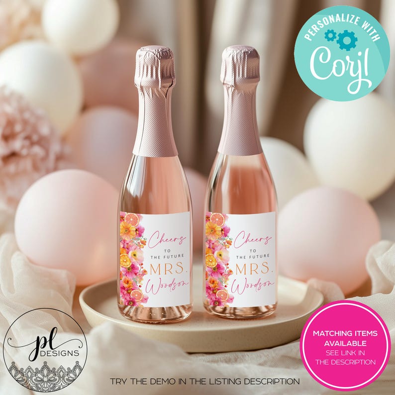 May include: Two mini champagne bottles with pink labels and floral designs. The labels read "Cheers to the Future Mrs. Woodson." The bottles are on a beige plate, surrounded by pink balloons. Text on the image says "Personalize with Corjl" and "Matching items available see link in the description."