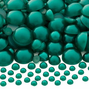May include: A collection of numerous teal-colored, half-round, dome-shaped beads with a smooth, glossy finish. The beads vary in size, ranging from small to large, and are arranged in a dense cluster that transitions to a sparse row at the bottom.
