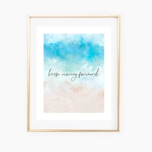 May include: A watercolor painting of a beach scene with blue water and a sandy beach. The text "keep moving forward" is written in black cursive on the sand.