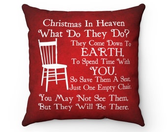 May include: Red throw pillow with white text that reads "Christmas In Heaven What Do They Do? They Come Down To EARTH, To Spend Time With YOU. So Save Them A Seat, Just One Empty Chair. You May Not See Them, But They Will Be There."