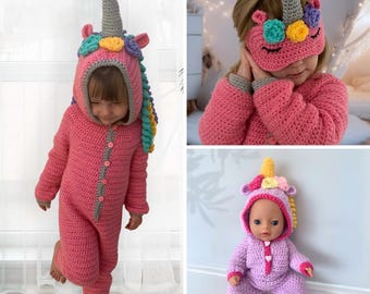 May include: Three crocheted unicorn outfits in pink, purple, and light pink. The outfits feature a unicorn hood with a horn, ears, and a mane. The outfits are designed for children and dolls.