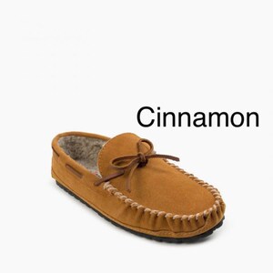 May include: A pair of brown suede moccasins with a faux fur lining and a leather tie. The moccasins are called "Cinnamon".