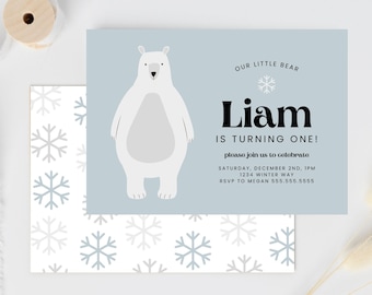 May include: A blue and white printable invitation with a polar bear illustration. The invitation says "Our Little Bear Liam is Turning One!" and includes details for a birthday party.