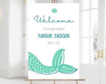 Peut inclure: Bienvenue à la fête prénatale de Hannah Jackson, le 15 juin 2022. Une pancarte blanche avec une queue de sirène turquoise et un motif de coquillage.