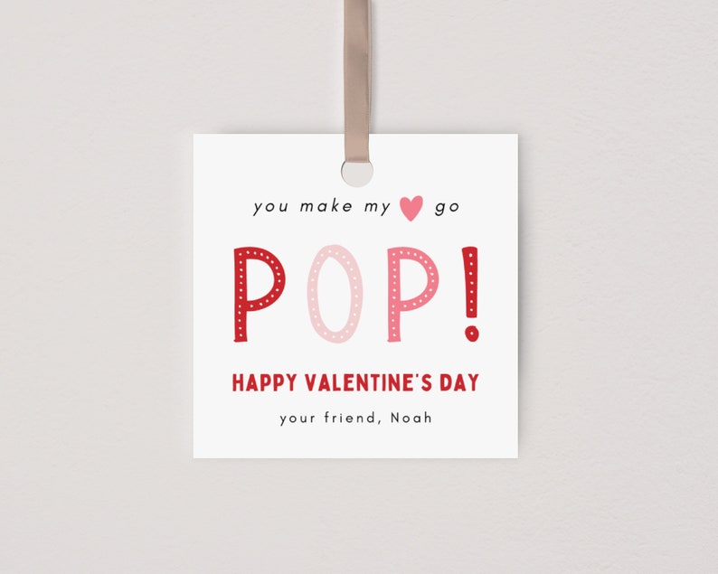 May include: A white card with red and pink polka dot letters spelling "POP!" with the text "you make my heart go POP! Happy Valentine's Day your friend, Noah"