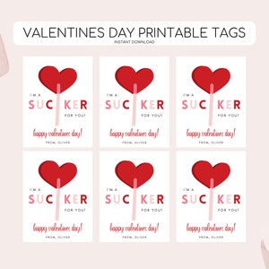 May include: Six printable Valentine's Day gift tags featuring a red heart-shaped lollipop with the text "I'm a sucker for you! Happy Valentine's Day! From, Oliver."
