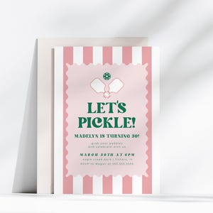 May include: A pink and white invitation card with the text "Let's Pickle!" in green. The card features a pickleball graphic and the text "Madelyn is turning 30!" The invitation is for a pickleball-themed birthday party.