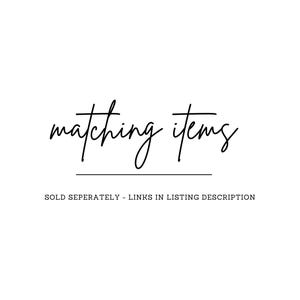 May include: White background with the words "matching items" in a cursive font. Below the text is a horizontal line. The text "SOLD SEPERATELY - LINKS IN LISTING DESCRIPTION" is below the line.