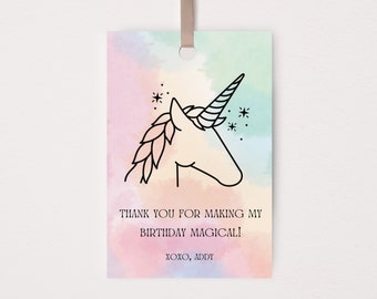 May include: A pastel-colored gift tag with a unicorn illustration and the text "THANK YOU FOR MAKING MY BIRTHDAY MAGICAL!" and "XOXO, ADDY". The tag has a ribbon for hanging.