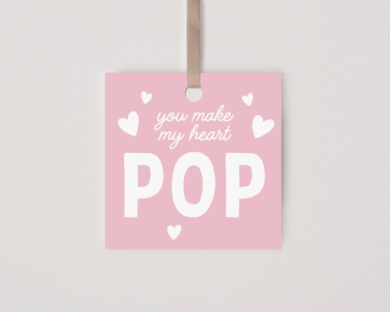 May include: Pink card with white hearts and the text "You make my heart POP" in white.