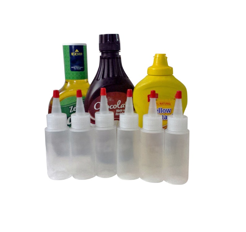 May include: Five clear plastic squeeze bottles with red caps and a yellow bottle with a black cap and the text "100% Natural Yellow Mustard" on the label.