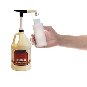 May include: A clear plastic bottle being filled with wood glue from a gallon jug with a pump dispenser. The jug is labelled "Original Wood Glue".