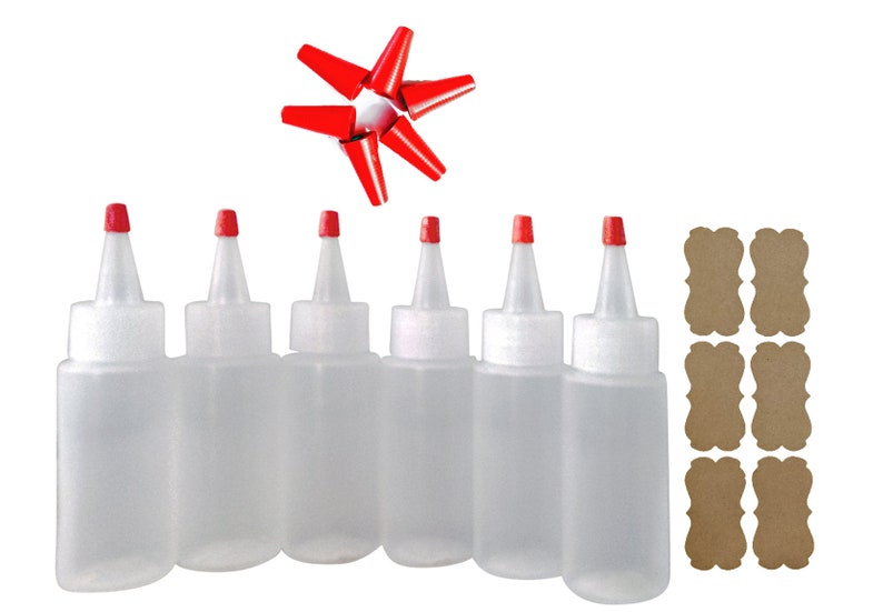 May include: Six clear plastic squeeze bottles with red caps and six red caps. The bottles are arranged in a row. There are six brown paper tags with scalloped edges.