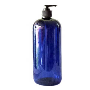 May include: A large, blue plastic bottle with a black pump dispenser. The bottle is empty and ready to be filled with liquid soap, lotion, or other products.