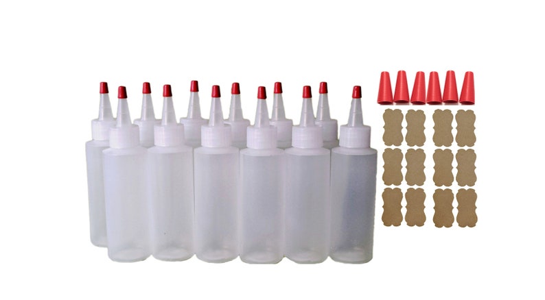 May include: Twelve clear plastic squeeze bottles with red caps and twelve brown paper labels. The bottles are arranged in three rows of four.
