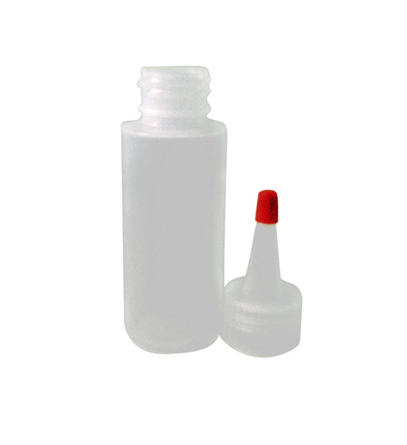 May include: A clear plastic bottle with a red cap and a separate squeeze bottle top. The bottle is empty and ready to be filled.