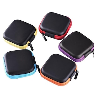 May include: Five square, black, semi-rigid cases with rounded corners and zippers. Each case features a distinct colored trim in yellow, red, purple, orange, or light blue. The cases are arranged in a circular formation against a white background.