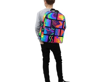 May include: A colorful backpack with a vibrant, geometric design. The backpack features a black background with a patchwork of rainbow-colored squares, each containing abstract shapes and lines. The backpack has a black top handle and straps.