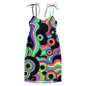 May include: A black mini dress with a vibrant, psychedelic pattern of swirling lines and concentric circles in neon colors. The dress features thin, adjustable straps tied at the shoulders.
