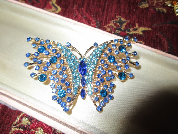 Lovely sparkly gold plated blue rhinestone glass butterfly brooch