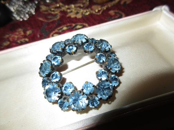 Lovely vintage black enamel blue rhinestone garland brooch