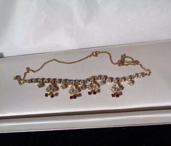 Lovely vintage goldtone clear and amethyst rhinestone necklace