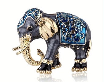 Lovely goldtone black and blue enamel elephant brooch