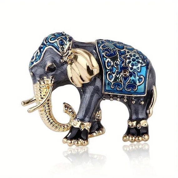 Lovely goldtone black and blue enamel elephant brooch