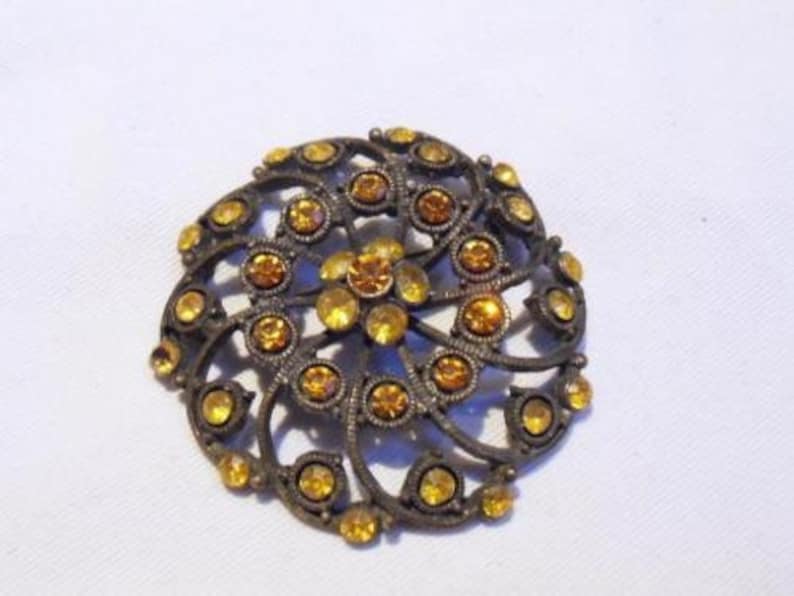 Fabulous Vintage large gold metal amber glass openwork brooch