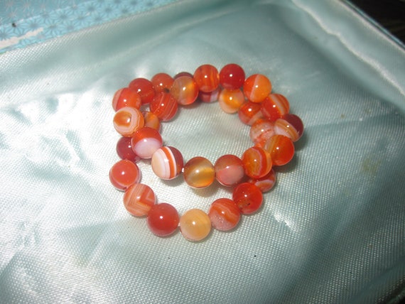 Lovely round 6.5 mm orange agate art glass stretch bracelet