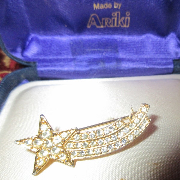 Wonderful vintage goldtone rhinestone shooting star brooch