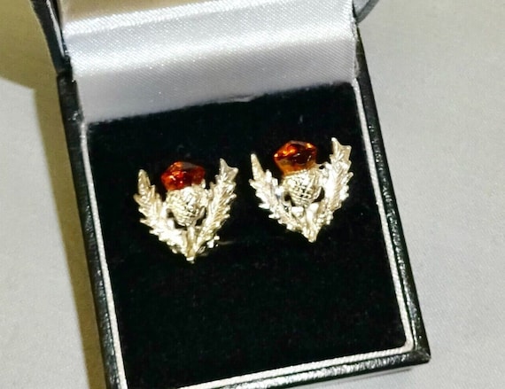 Lovely vintage pair of silvertone Scottish Celtic thistle topaz glass clip on earrings