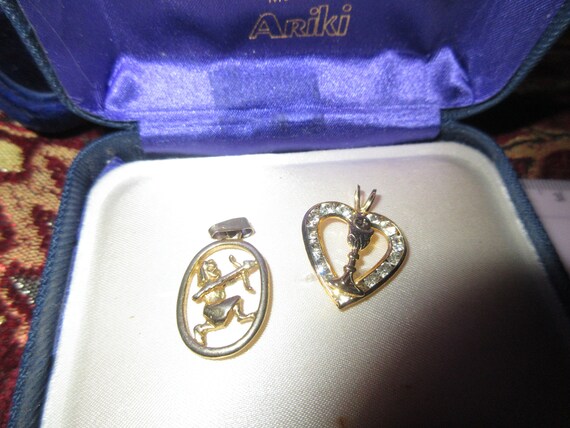 2 Wonderful vintage gold plated cupid archer and heart pendants