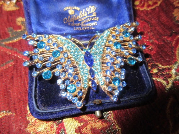 Lovely sparkly gold plated blue rhinestone glass butterfly brooch