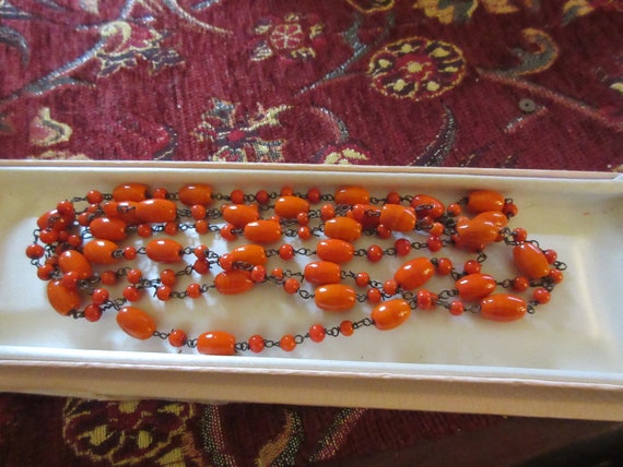 Lovely antique Deco wire linked coral orange glass end of day necklace 48"