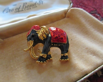 Lovely goldtone black and red enamel elephant brooch