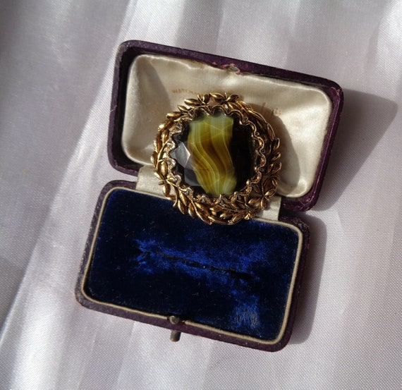 Charming vintage Scottish goldtone banded olive green glass brooch