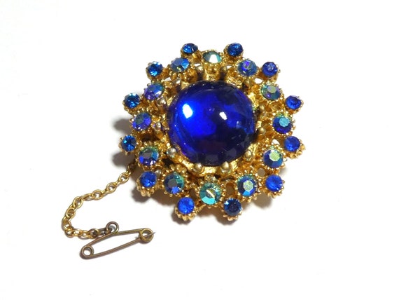 Lovely vintage goldplated Blue Glass Aurora Borealis Rhinestone brooch