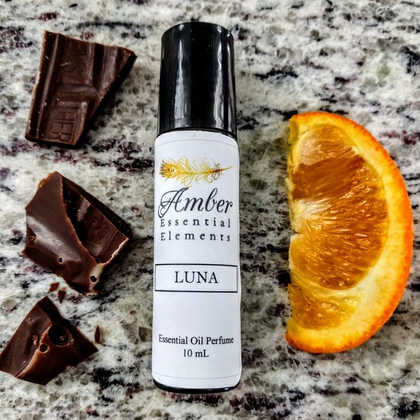 Luna: cocoa, wild orange, frankincense, and cedarwood perfume blend