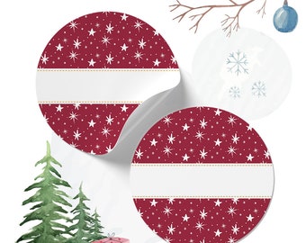May include: Two red and white Christmas gift tags with a white snowflake pattern and a white space for writing. The tags are round and have a peel-off backing.